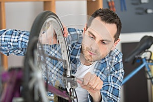 man bicycle mechanic repairing bicycles