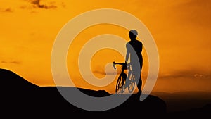 Man and bicycle on mountain