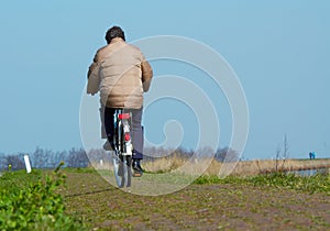 Man on bicycle in spring