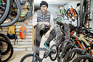 Man with bicycle at the store