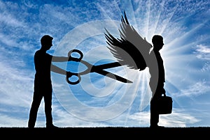 A man with big scissors in his hands intends to cut off the wings of the man in front of him