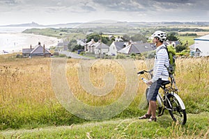 Man on bike, enjoying view