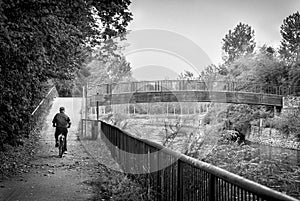 Man in bike near bridge