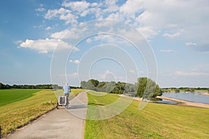 Man on bike near river