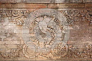 Man on bike is the stone relief carving at Pura Mauwe Karang