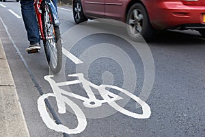 Man On Bike Using Cycle Lane As Traffic Speeds Past