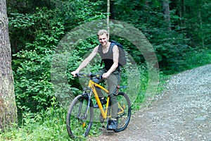 Man on a bike in the woods