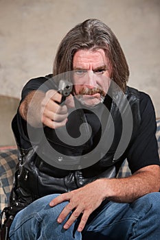 Man in Biker Gang Vest with Gun