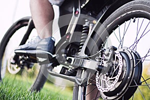 Man biker sitting on electric bike