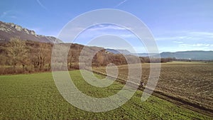 Man biking off road on a field path on a sunny spring day