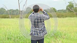 Man with binoculars telescope in forest looking destination as lost people or foreseeable future. People lifestyles and leisure