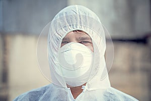Man in bio hazard protective suit with respirator mask.  Novel coronavirus - 2019-nCoV, WUHAN virus concept