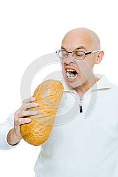 Man biting a loaf. Isolated on white
