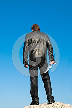 Man in black with an antique knife