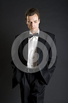 Man in black dinner jacket with bow tie