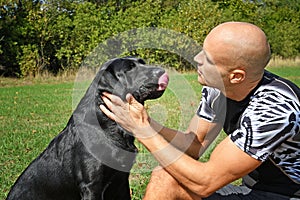 Man with black dog