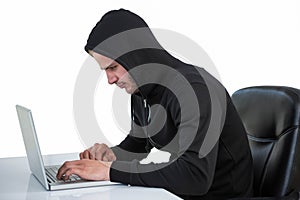 Man in black hoodie using laptop