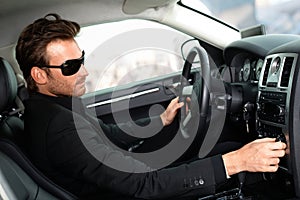 Man in black in luxury car