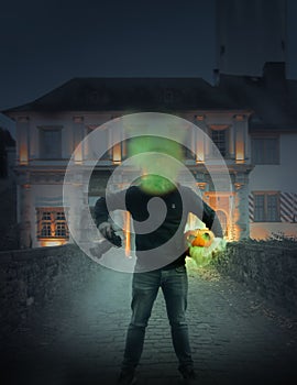 Man in black with neon light mask. He's holding a Halloween pumpkin in his hands, night, Purge mask, Halloween horror.