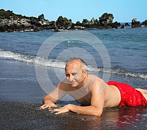 Man on Black sand beach