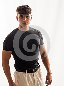 Man in black shirt and tan shorts