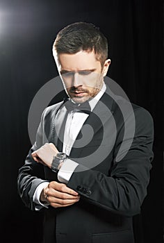 Man in black suite whit watch