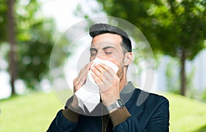 Man blowing his nose