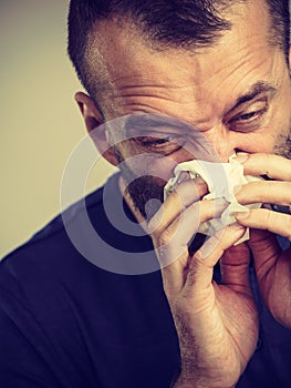 Man blowing nose