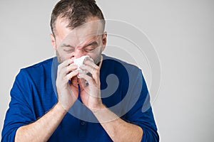 Man blowing nose
