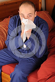 Man blowing nose