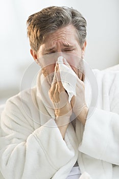 Man Blowing Nose In The Handkerchief