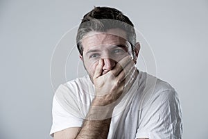 Man with blue eyes sad and depressed looking lonely and suffering depression feeling sorrow