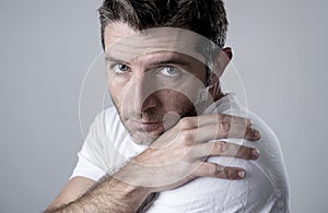 Man with blue eyes sad and depressed looking lonely and suffering depression feeling sorrow