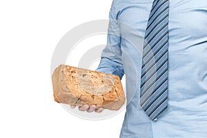 A man in a blue shirt and tie holds an orange brick in his hand, his face is not visible, isolated on a white