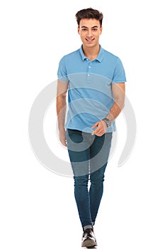 Man in blue shirt walking to the camera