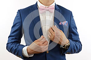 Man in blue suit bowtie, pocket square