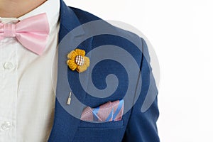 Man in blue suit bowtie, pocket square