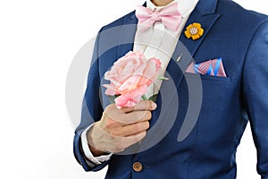 Man in blue suit carry flowers