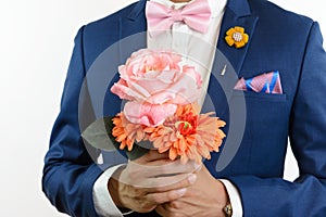 Man in blue suit carry flowers