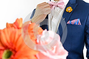 Man in blue suit carry flowers