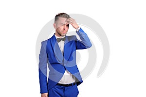 Man in blue suite with incredulous face on white background photo