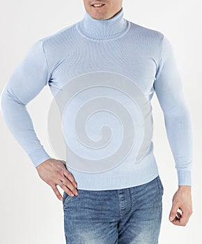 Man in a blue turtleneck with long sleeves on a white background