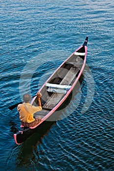 Man in boat. Kerala backwaters