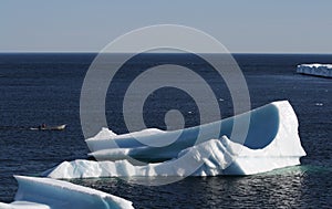 Man in Boat near Icebergs