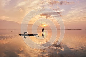 Man in boat at sunset