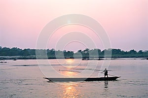 Man on boat at sunset, Chitwan Nepal