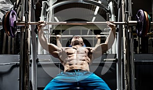 Man bodybuilder perform exercise