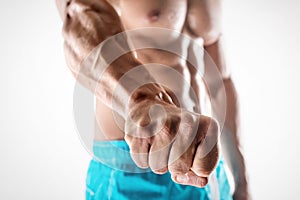Man bodybuilder showing fist