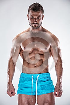 Man bodybuilder showing muscular body