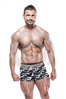 Man bodybuilder showing muscular body